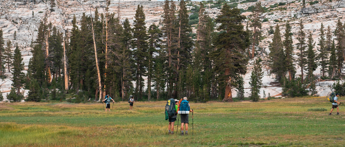 Young people in the backcountry at golden hour