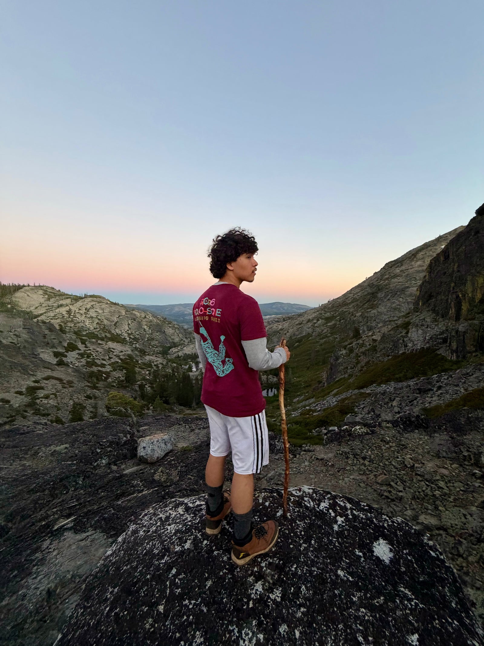 Hiker with backpack on rocky terrain