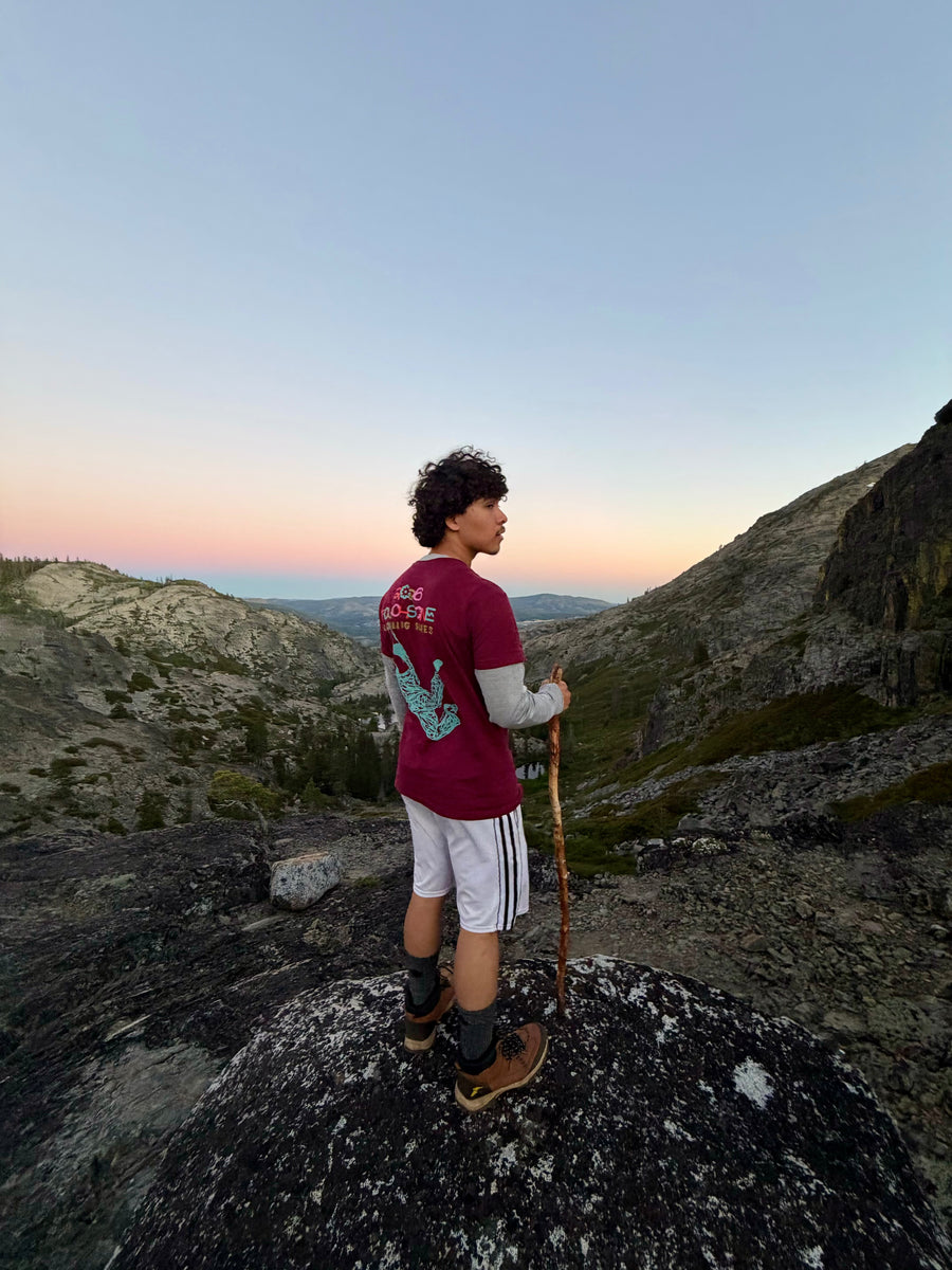 Hiker with backpack on rocky terrain