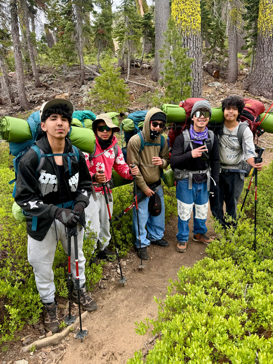 Group of teenagers on a dirt trail