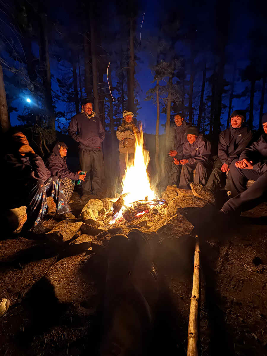 Small campfire surrounded by rocks