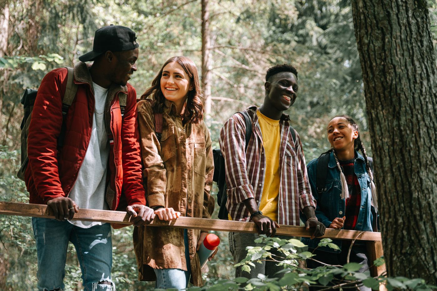 Diverse group of friends hiking in a forest