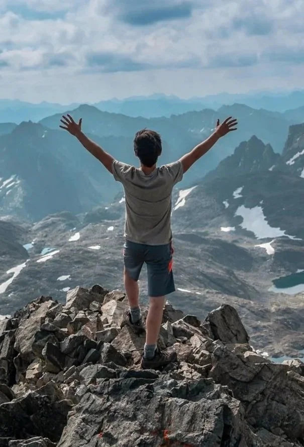WILD Program participant at the top of a mountain