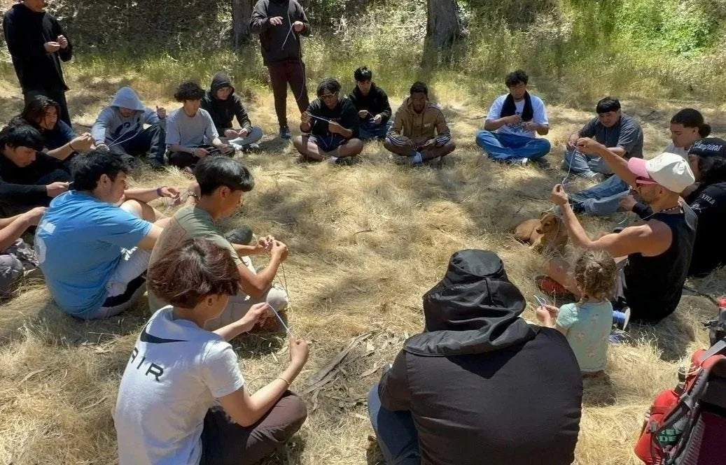 Group sitting in a circle outdoors